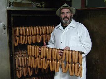 Product: Wurstmeister Mike makes 46 different bratwurst flavors at the Hermann Wurst Haus - Hermann Wurst Haus in Historic Downtown Hermann - Hermann, MO Delicatessen Restaurants