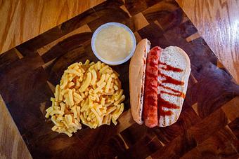 Product: Kids Hot Dog on a Bun with Mac & Cheese and Applesauce - Hermann Wurst Haus in Historic Downtown Hermann - Hermann, MO Delicatessen Restaurants