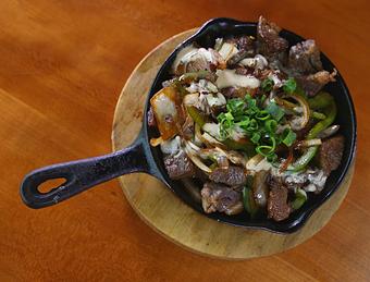 Product: Served Sizzling in a cast iron skillet - Highway Inn Kaka'ako in Kaka'ako - Honolulu, HI Diner Restaurants