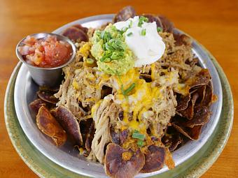 Product: With Kālua Pig, guacamole, salsa, and 'house made `uala chips - Highway Inn Kaka'ako in Kaka'ako - Honolulu, HI Diner Restaurants