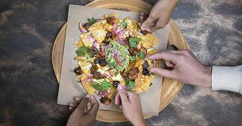 Product: slow-smoked BBQ brisket, house-cut tortilla chips, 
aged cheddar, avocado, roasted corn salsa, red onion, 
cotija cheese - House of Blues Restaurant & Bar in Myrtle Beach, SC Restaurants/Food & Dining