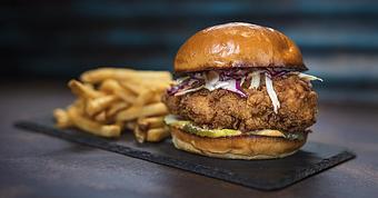Product: bourbon-butter-brushed fried chicken breast, with 
slaw, buffalo aioli and dill pickles (available simply grilled) - House of Blues Restaurant & Bar in Myrtle Beach, SC Restaurants/Food & Dining