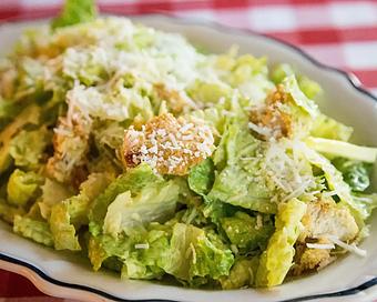 Product: an italian classic! romaine is chopped and tossed with house-made croutons, celery, parmesan cheese and creamy caesar dressing - Il Porcellino in River North - Chicago, IL Italian Restaurants