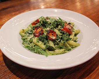 Product: penne pasta tossed with oven roasted tomatoes and fresh basil pesto, garnished with parmesan cheese. pro tip: great as a vegan option, just ask for no cheese - Il Porcellino in River North - Chicago, IL Italian Restaurants