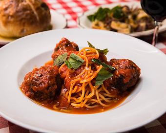 Product: a true classic: 3 prime beef meatballs simmered in marinara and served with imported spaghetti - Il Porcellino in River North - Chicago, IL Italian Restaurants