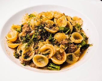 Product: crumbled italian sausage, kale, fresh garlic, tossed in a calabrian chili brodo, and finished with parmesan cheese and fennel pollen - Il Porcellino in River North - Chicago, IL Italian Restaurants