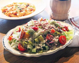 Product: just like nonna used to make it! fresh chopped romaine with Genoa salami, fresh provolone, roasted peppers, red onion, fennel, celery, and cucumber, served with a zesty italian vinaigrette - Il Porcellino in River North - Chicago, IL Italian Restaurants