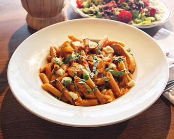 Product: penne pasta tossed with a creamy asiago tomato sauce, fresh mozzarella, and shredded roasted chicken. garnished with fresh basil - Il Porcellino in River North - Chicago, IL Italian Restaurants