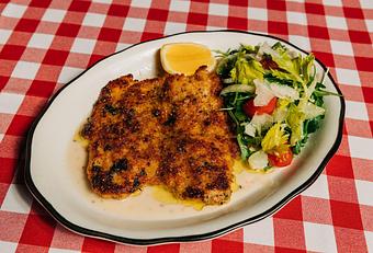 Product: Breaded free range chicken breast served with a lemon and basil brodo and a bright arugula salad - Il Porcellino in River North - Chicago, IL Italian Restaurants