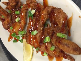 Product: Soft Shell crabs on a stick topped with General Tso's sauce - Jerry's Place in Prince Frederick, MD Seafood Restaurants