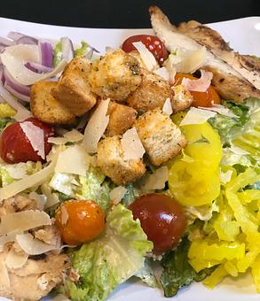 Product: Caesar Salad (pictured with sliced chicken breast) - Jester's Cafe in WILMINGTON, NC American Restaurants