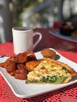 Product: Our homemade quiche (pictured: spinach, tomato, feta with home fries) - Jester's Cafe in WILMINGTON, NC American Restaurants