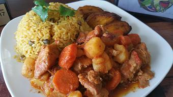 Product: Pollo Guisado con arroz con gandules y maduros - Joe's Caribe Restaurant and Bakery in Scenic Heights - Pensacola, FL Caribbean Restaurants