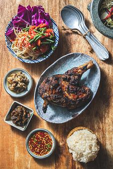 Product: Roasted Bell & Evans Chicken / Smashed Papaya Salad - Khe Yo in TriBeCa - New York, NY Thai Restaurants