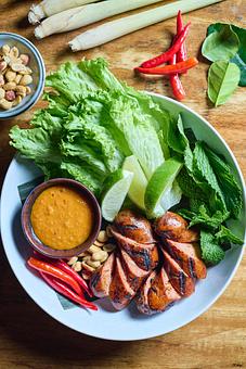 Product: Lemongrass Chicken Sausage with Sweet pEanut Sauce & Rau-Rum - Khe Yo in TriBeCa - New York, NY Thai Restaurants