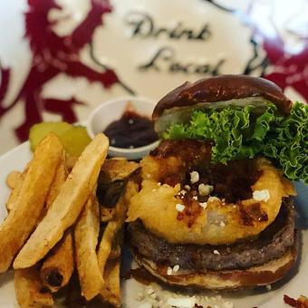 Product: Burgers / 100% Certified Hereford beef that is locally sourced served on a pretzel bun. - Kimberlee J Verbsky in Hillsboro, WI American Restaurants