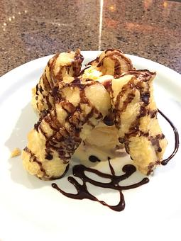 Product: Banana tempura with vanilla ice cream and chocolate syrup on top. - Koki's Teppanyaki Grille in Tustin, CA Japanese Restaurants