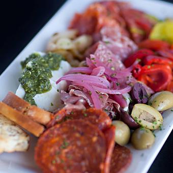 Product: Antipasto della Casa - An assortment of quality Italian meats and imported cheese, roasted red peppers, olives, roasted garlic and pepperoncinis - La Trattoria Oceanside in Key West Airport - Key West, FL Italian Restaurants