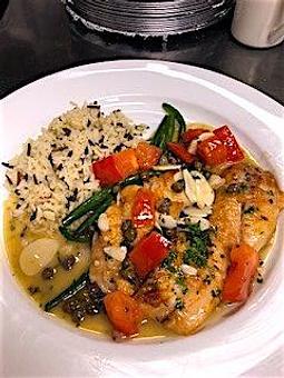 Product: Snapper Dentice - Fresh local yellowtail snapper filet sautéed with capers, fresh tomatoes, garlic slivers and lemon in a white wine butter sauce - La Trattoria Restaurant in Old Town - Key West, FL Bars & Grills