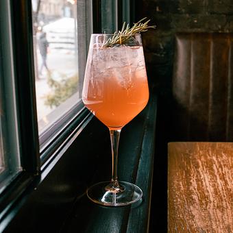 Product: pomegranate, bonanto, rosemary simple, aperol & sparkling cava - Lil’ Ba-Ba-Reeba! in River North - Chicago, IL Bars & Grills