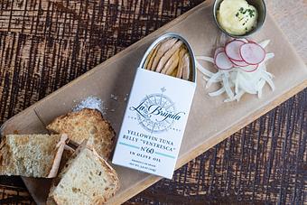 Product: A wooden board with an open white tin of sardines, pieces of bread, and slices of radish and onion with a small container of white sauce - Lil’ Ba-Ba-Reeba! in River North - Chicago, IL Bars & Grills