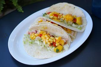 Product: New England Tacos - 3 soft tacos stuffed with lobstah, napa, roast corn, and mango salsa. - Lobstah On A Roll in Back Bay; Newbury Street - Boston, MA American Restaurants