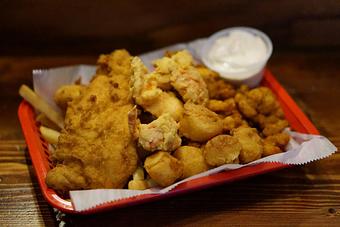 Product: The G.O.A.T. - Clam strips, scallops, haddock, lobstah, and fries. - Lobstah On A Roll in Back Bay; Newbury Street - Boston, MA American Restaurants