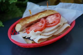 Product: Sweet Caroline - Roasted turkey breast, lettuce, tomato, and cranberry mayo. - Lobstah On A Roll in Back Bay; Newbury Street - Boston, MA American Restaurants
