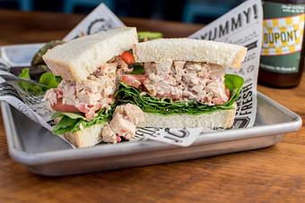 Product: Tothill Farms chicken breast, chipotle mayo, red onion, carrot, celery, raisin, red pepper, spinach and tomato on Clasen's spent grain white bread - Longtable Beer Cafe in Downtown Middleton - Middleton, WI American Restaurants