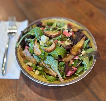 Product: Local greens, roasted Bosc pear, beauty heart radish, toasted pepitas, tarragon, mint, maple dijon vinaigrette, Hook's Little Boy Blue crumbles - Longtable Beer Cafe in Downtown Middleton - Middleton, WI American Restaurants