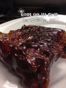 Product: BBQ Ribs shown with our house BBQ sauce - Lost on 111 Grill in La Quinta, CA American Restaurants