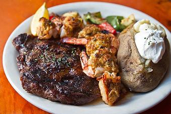 Product: Hand cut Drunken Ribeye with a side of Crab stuffed Shrimp makes a perfect meal! - Mackey's American Pub in Manassas, VA American Restaurants