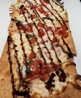 Product: Brushchette flatbread - Marco Polo's - For Information and Reservations in Great Neck, NY Bars & Grills