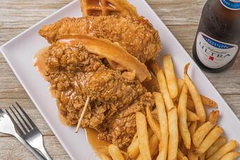 Product: Chicken & Waffle (pictured with French fries) - Mason's Grill in Baton Rouge, LA American Restaurants