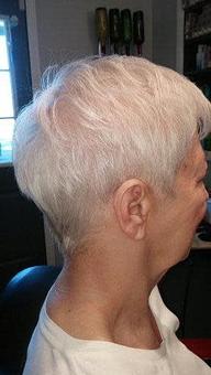 Product: Short tapered cut on sides and back with longer layers on top with some texture to give lift. - Meadow Street Styles in Hadley, MA Restaurants/Food & Dining