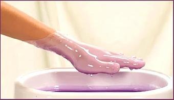 Product: Dip your hands in warm lavender paraffin wax to soften and moisturize your skin - Mikel’s The Paul Mitchell Experience in Tampa, FL Day Spas