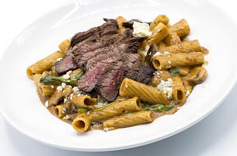 Product: RIGATONI & BLACKENED SKIRT STEAK Gorgonzola, spinach, porcini mushroom-sage cream sauce - Mill Creek Tavern in Bayville, NY American Restaurants