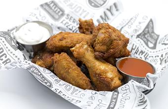 Product: CLASSIC CHICKEN WINGS Hot sauce, bleu cheese dressing, celery - Mill Creek Tavern in Bayville, NY American Restaurants