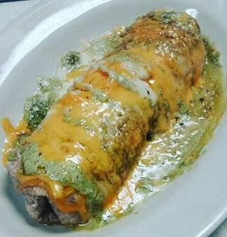 Product: Lunch Special Burrito filled with pulled pork and cheese topped with special sauces - Moby's Bar & Grill in Metairie, LA Bars & Grills