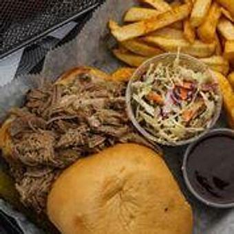 Product: Pulled pork sandwich served with fries and house made BBQ sauce - Moby's Bar & Grill in Metairie, LA Bars & Grills