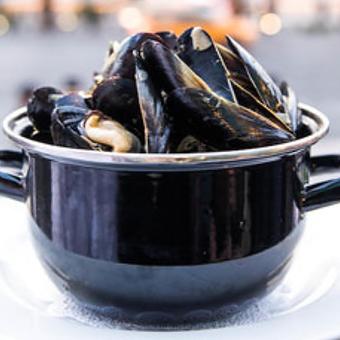 Product: Pot of Mussels Marinère ~ leek, onion, garlic, white wine, herb butter - Mon Ami Gabi in Lincoln Park West - Chicago, IL French Restaurants