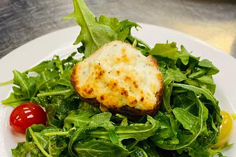 Product: Arugula Salad with sherry vinaigrette, goat cheese croutons and confit heirloom cherry tomatoes - Mon Ami Gabi in Reston Town Center - Reston, VA French Restaurants