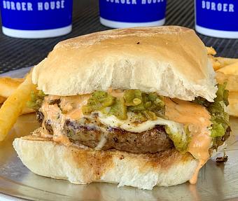Product: Burger topped with Hatch Green Chile, Havarti Cheese and a Honey/Sriracha Sauce. - Moonie's Burger House - Anderson Mill in Austin, TX Hamburger Restaurants