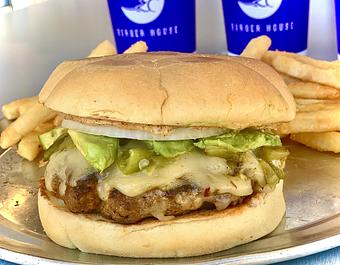 Product: A CHORIZO burger (50/50 Chorizo and  Ground Chuck) Topped with Pepperjack Cheese, Hatch Green Chile, Sliced Avocado, Onion, Chipotle Mayo and Served on Our Toasted Potato Bun. - Moonie's Burger House - Anderson Mill in Austin, TX Hamburger Restaurants