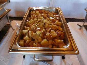 Product: Red skin potatoes with diced onions and drenched in dairy fresh butter. - Ms Piggie's BBQ in Coopersville, MI Barbecue Restaurants