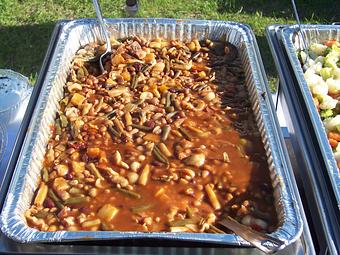 Product: All of your favorite beans blended and slow cooked in a sweet and sour BBQ sauce. - Ms Piggie's BBQ in Coopersville, MI Barbecue Restaurants