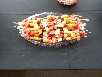 Product: Grapes and melon chunks skewered for easy eating. - Ms Piggie's BBQ in Coopersville, MI Barbecue Restaurants