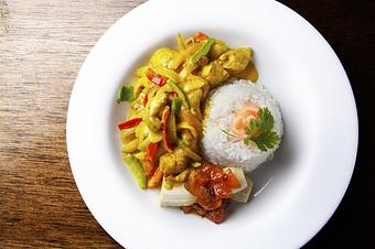 Product: Red curry, sautéed chicken, roasted peppers, jasmine rice, fresh banana, chutney - Novecento Brickell in Miami, FL Steak House Restaurants