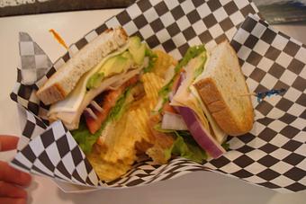 Product: Bacon, Avocado, Tomato, Lettuce, and Swiss Cheese. Served with Chips and a Pickle - Nutshell Eatery & Bakery in Granbury, TX American Restaurants