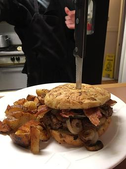 Product: Grilled 1/2 lb Burger with Crispy Bacon and Grilled Onions, Served with Roasted Potato Wedges! - Odd Fellow Cafè & Coffee in Pierceton, IN Coffee, Espresso & Tea House Restaurants